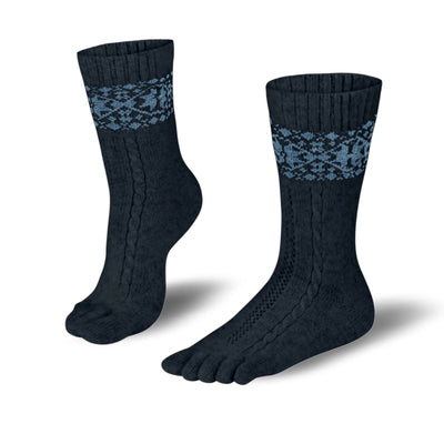 A photo of anthracite and blue knitted toe socks, they have blue detailed snowflake design around the mid-calf. Both socks are shown from the left side with one sock shown standing with the front of foot on the ground and the back heel lifted. They are shown on a white background. #color_anthracite-light-blue