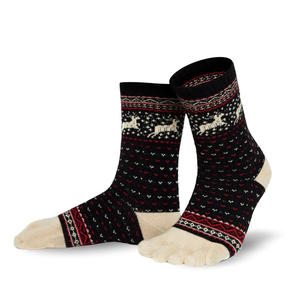 A photo of the Knitido Hossa reindeer sweater toe socks, which are cotton and wool blend. The socks are black in color with beige and red festive details all over the sock and reindeer around the ankle. The toes and heels are beige. Both socks are shown from the left side on a white background. #color_black-beige