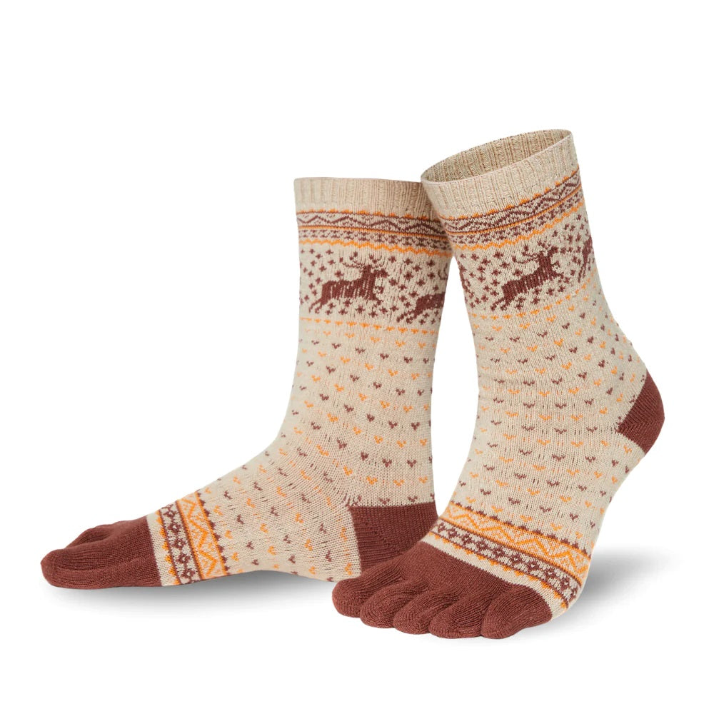 A photo of the Knitido Hossa reindeer sweater toe socks, which are cotton and wool blend. The socks are beige in color with brown and yellow festive details all over the sock and reindeer around the ankle. The toes and heels are brown. Both socks are shown from the left side on a white background. #color_beige-brown