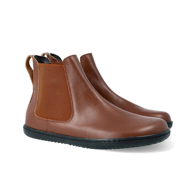 Brown smooth leather Angles Nyx Chelsea boot. Boots are simple in design with a long pull tab attached to the heel. Both boots are shown facing diagonally right against a white background. #color_brown