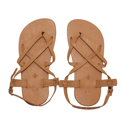 A tan leather strappy sandal with a silver buckle in the back. Both sandals are shown from above against a white background. #color_tan