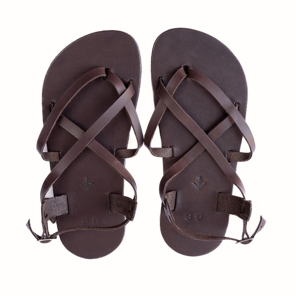 A brown leather strappy sandal with a silver buckle in the back. Both sandals are shown from above against a white background. #color_brown