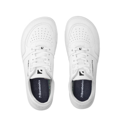 A photo of all white Barebarics Wave classic leath sneakers. Toe box is perforated, the sole is white with tan thread, barebarics brand name is written on the side. Both sneakers are shown here from above against a white background. #color_all-white