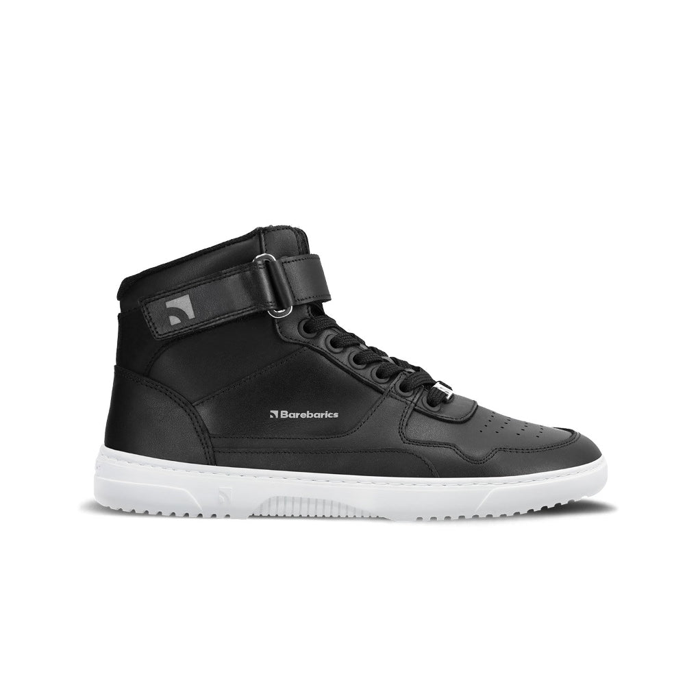 Photo 1 - A photo of black & white Barebarics Zing Hi-Top leather sneakers. The sneakers white with perforated spots on the top of the toe box, have barebarics branding on the tongue and side, and a velcro strap at the ankle. Right sneaker is shown facing right here against a white background. Photo 2 - Both shoes are shown from above against a white background. #color_black-white