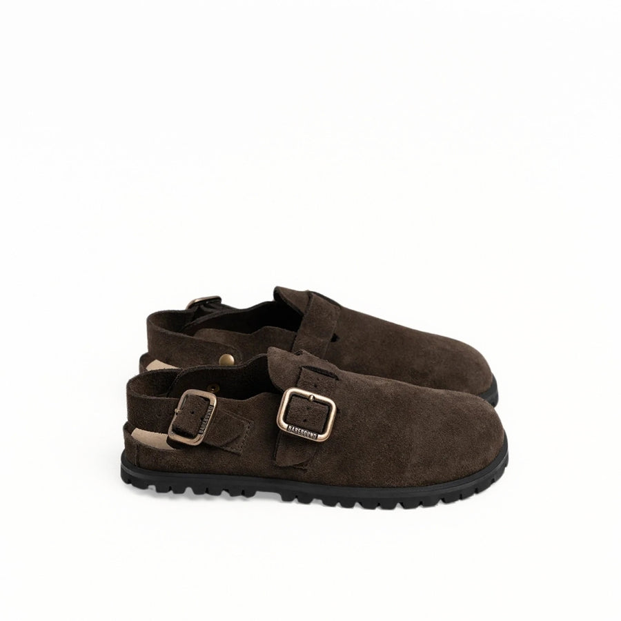 Dark brown suede leather Barebound Ikaros II clogs with a buckle strap around the heel, a tan footbed, and thicker, black rubber soles. Both shoes are shown facing right against a white background. #color_dark-brown