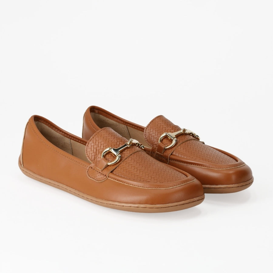 Pair of Be Lenka Divella Biscuit tan leather loafers angled on white background, featuring woven uppers and gold horsebit buckles. #color_biscuit