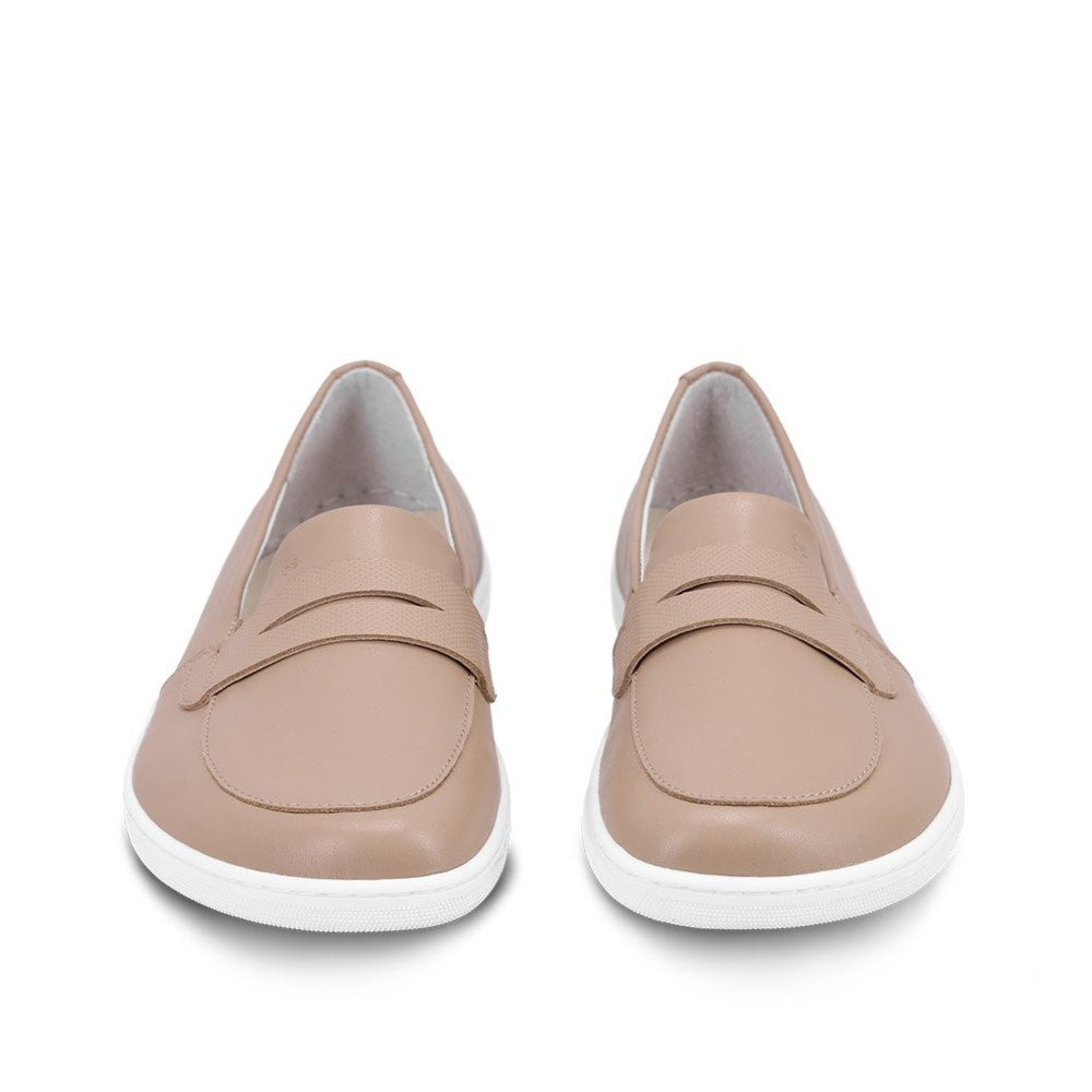 A photo of a penny loafer with a decorative vamp. Both loafers are shown beside each other from the front. The loafers are latte in color with a white sole shown against a white background. #color_latte-brown