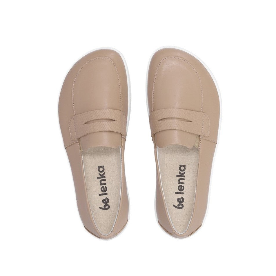 A photo of a penny loafer with a decorative vamp. Both loafers are shown beside each other facing upright. The loafers are latte in color with a white sole shown against a white background. #color_latte-brown