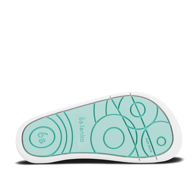 Blue canvas Be Lenka Canvi sneakers with  two velcro straps, white faux suede toe caps, white and teal rubber soles, and a pull tab at the heel. Right shoe sole is shown facing right against a white background. #color_blue