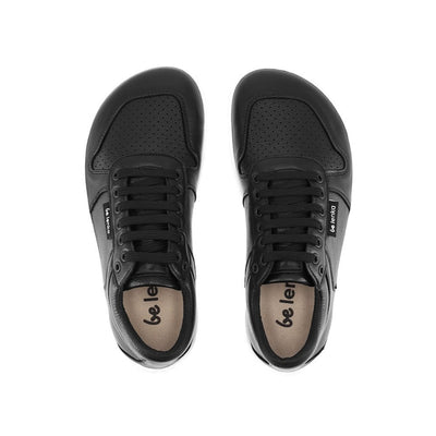 A photo of Belenka Champ sneakers made from leather and white rubber soles. The sneakers are black in color with perforation on the toe box and detail stitching. Both sneakers are shown facing upright beside each other from the top down against a white background. #color_black-white