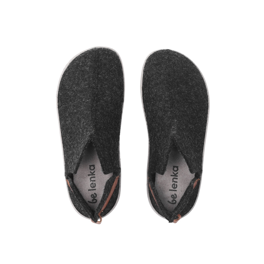 Photo 1 - A photo of Belenka Chillax felt ankle height slippers in black with grey soles. Slippers have a v cut on both sides of the ankle and a brown pull tab attached at the middle back of the ankle. Right slipper is shown from the right side against a white background. Photo 2 - Both slippers are shown from the top down against a white background. #color_black
