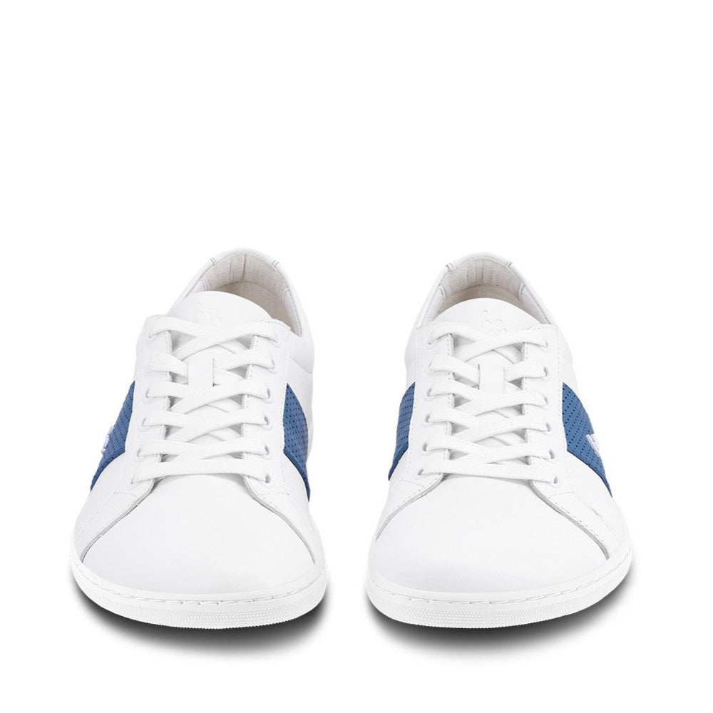 White leather Be Lenka Elite shoes with a thick, perforated, diagonal, blue leather stripe on both sides of the sneaker. A cursive, metal "be" logo design is in the center of the outside stripe. Both shoes are facing the camera against a white background. #color_white-dark-blue