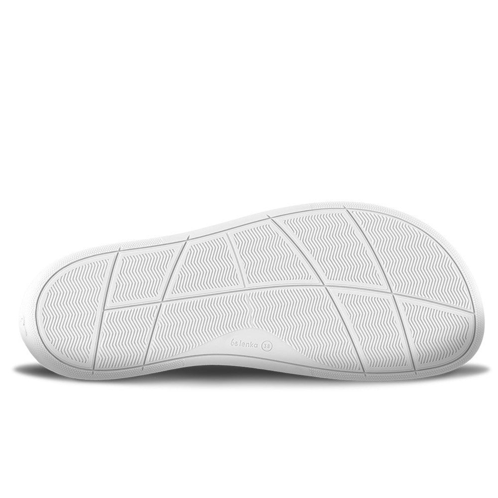 White leather Be Lenka Elite shoes with a thick, perforated, diagonal, blue leather stripe on both sides of the sneaker. A cursive, metal "be" logo design is in the center of the outside stripe. Right shoe sole is shown facing right against a white background. #color_white-dark-blue