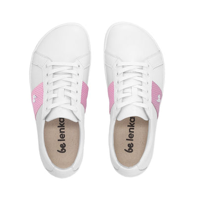 Photo 1 - A photo of white & pink Be Lenka Elite leather sneakers. Shoes have pink perforated leather blocks on both sides of the shoe with a Be Lenka logo in the center. Right sneaker is shown facing right against a white background. Photo 2 - Both shoes are shown from above against a white background. #color_white-pink