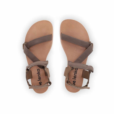 A photo of Olive Green Be Lenka Flexi Sandals made with fabric straps with velcro and a tan leather topped rubber soles. The sandals have straps that cross the front of the foot and continue around the mid-foot, ankle, and heel. Both sandals are shown from above against a white background. #color_olive-green