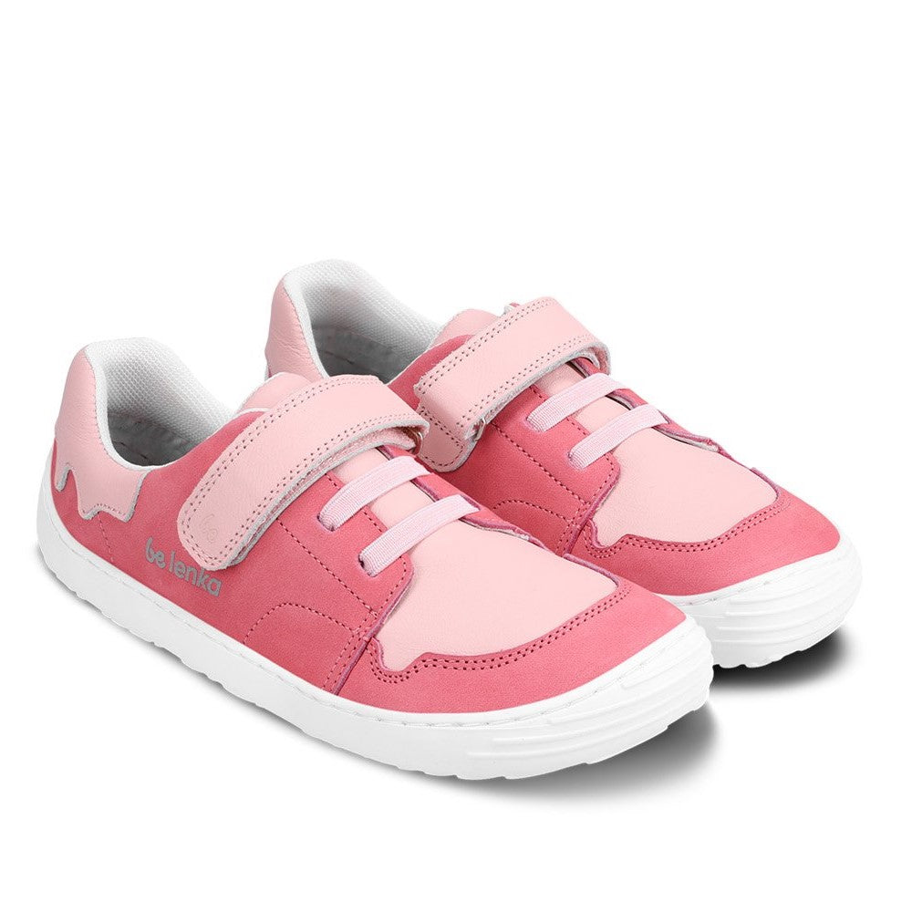 A photo of Pink Be Lenka Gelato kids leather sneakers with white rubber soles. Shoes are dark pink with light pink accent color blocks on the tongue, toe box, single top velcro closure, two elastic laces below that, and a "dripping" ice cream color block on the heel. Both shoes are facing diagonally right against a white background. #color_pink