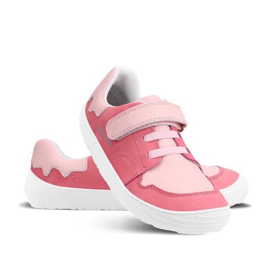 A photo of Pink Be Lenka Gelato kids leather sneakers with white rubber soles. Shoes are dark pink with light pink accent color blocks on the tongue, toe box, single top velcro closure, two elastic laces below that, and a "dripping" ice cream color block on the heel. Left shoe is facing right and right shoe is propped on top of the left facing diagonally right against a white background. #color_pink