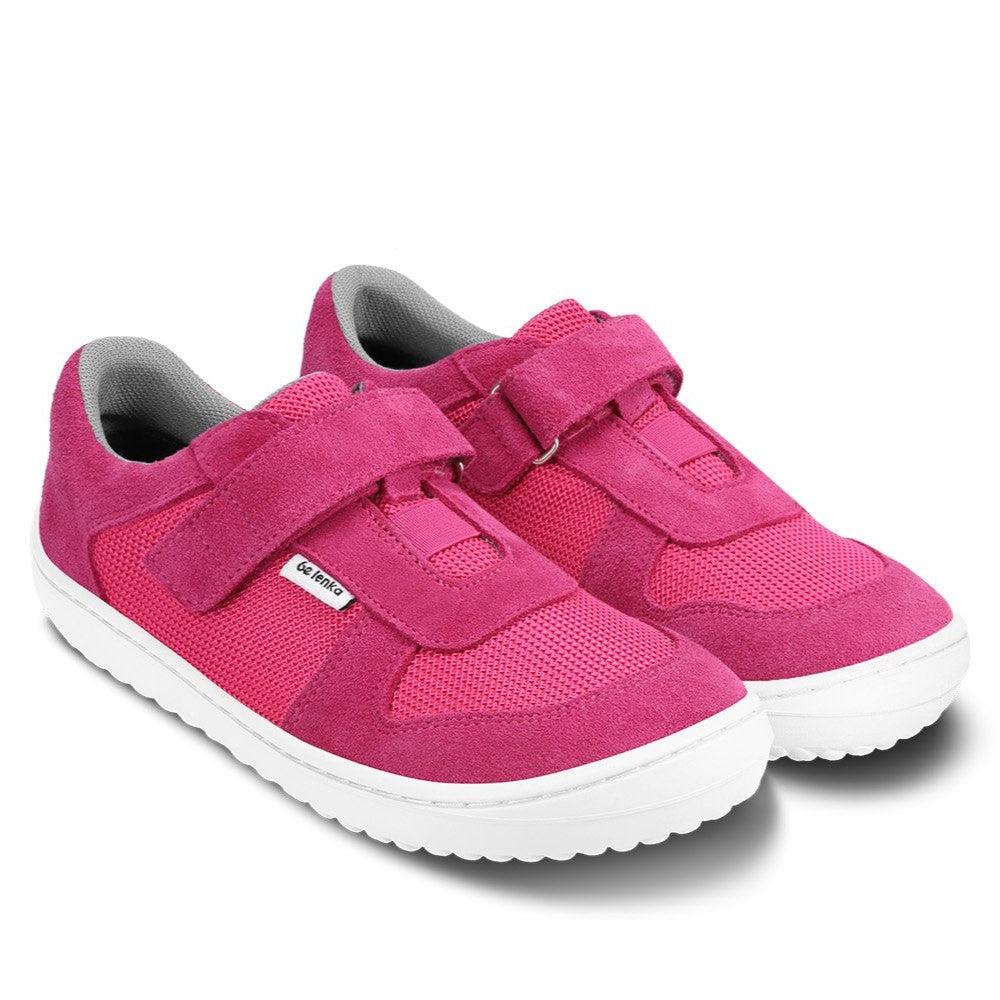 Photo 1 - A photo of Be Lenka Joy kids play shoes in dark pink and white. They are made of mesh and suede in a classic sneaker design. A velcro strap at the top of the tongue and elastic band just below are in place of laces. Both shoes are shown diagonally from the front right against a white background. Photo 2 - Both shoes are shown from the top down against a white background. #color_dark-pink-white