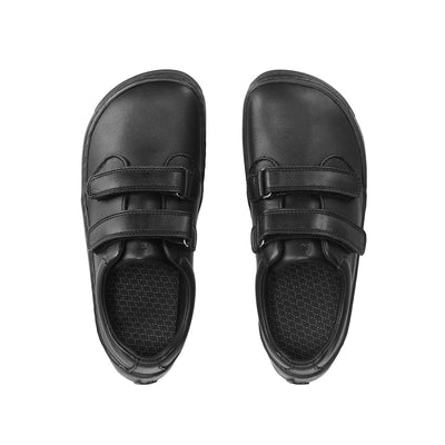 Photo 1 - A photo of Be Lenka Bounce kids play sneaker in all black smooth leather with black soles. Shoes are simple in design with two velcro closures. Right shoe is shown from the right side against a white background. Photo 2 - Both shoes are shown from the top down against a white background. #color_all-black