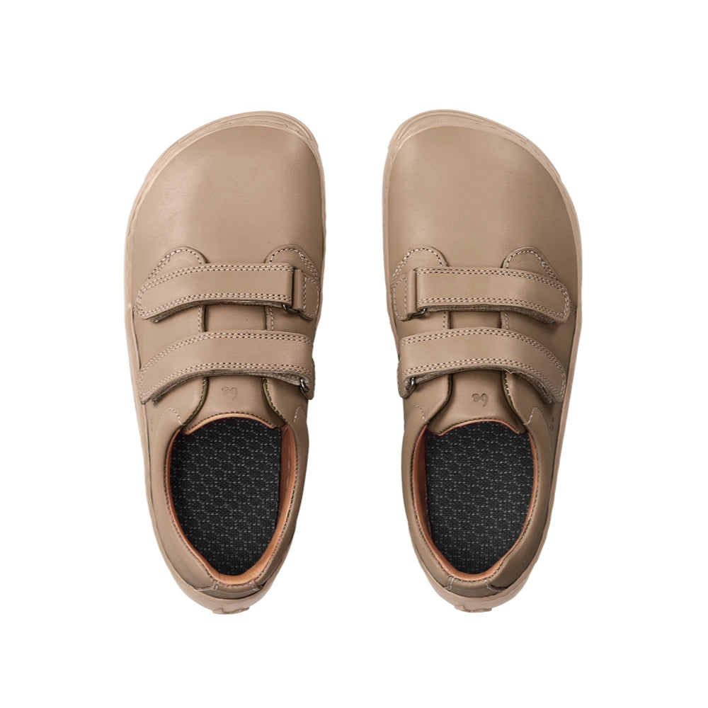 Photo 1 - A photo of Be Lenka Bounce kids play sneaker in all brown smooth leather with tan soles. Shoes are simple in design with two velcro closures. Right shoe is shown from the right side against a white background. Photo 2 - Both shoes are shown from the top down against a white background. #color_all-brown