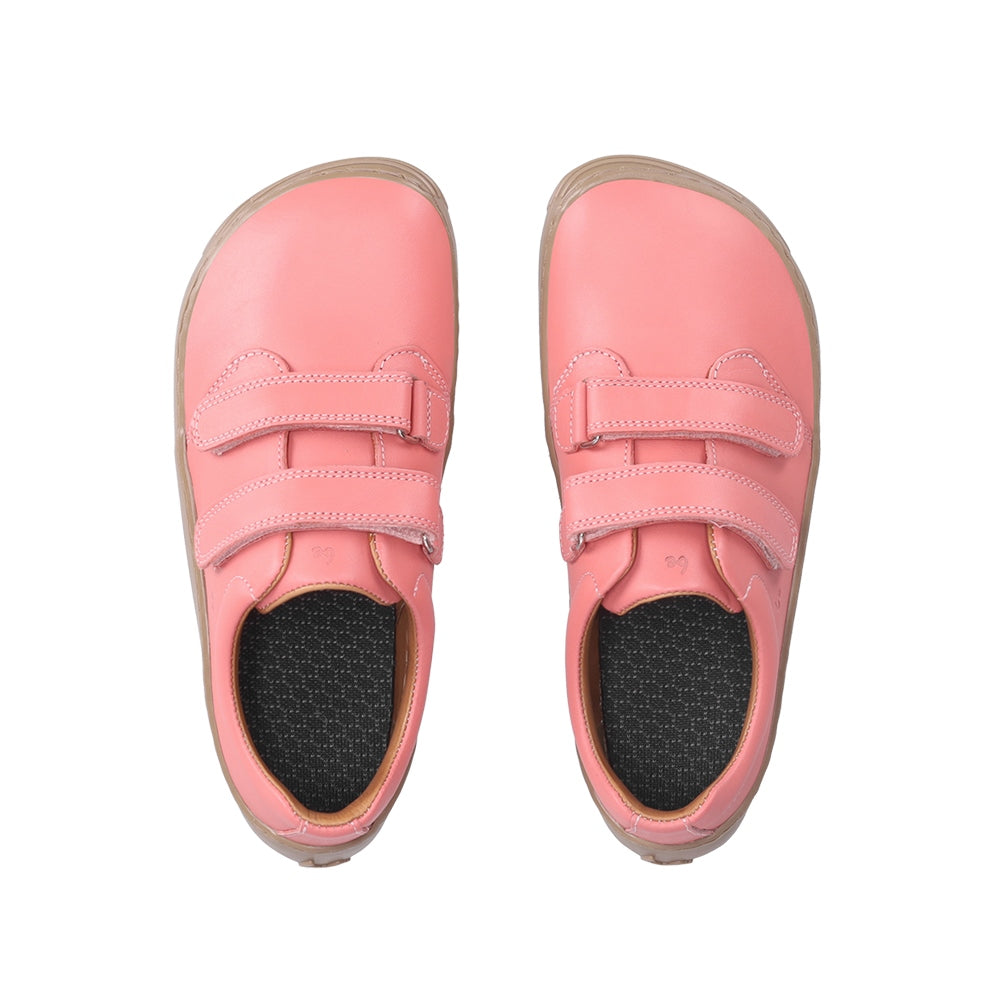 Photo 1 - A photo of Be Lenka Bounce kids play sneaker in coral pink smooth leather with tan soles. Shoes are simple in design with two velcro closures. Right shoe is shown from the right side against a white background. Photo 2 - Both shoes are shown from the top down against a white background. #color_coral-pink