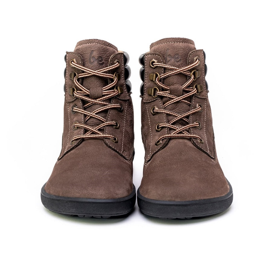 A photo of Be Lenka Nevada Boots made from nubuck leather and rubber soles. The boots are chcolate brown in color, they are combat boot style with laces a padded color and a chunky eyelets. Both boots are shown beside each other from the front against a white background. #color_chocolate
