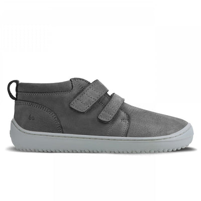 Photo 1 - A photo of Be Lenka Play kids ankle sneaker in dark grey with grey soles. Shoes are a simple leather design with two velcro closures. Right shoe is shown from the right side against a white background. Photo 2 - Both shoes are shown from the top down against a white background. #color_dark-grey