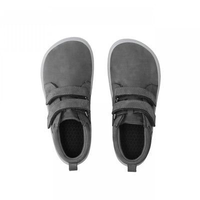 Photo 1 - A photo of Be Lenka Play kids ankle sneaker in dark grey with grey soles. Shoes are a simple leather design with two velcro closures. Right shoe is shown from the right side against a white background. Photo 2 - Both shoes are shown from the top down against a white background. #color_dark-grey