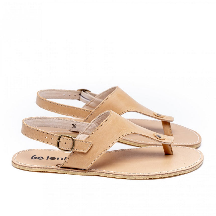 A photo of Sand Be Lenka Promenade Sandals made with leather and tan rubber soles. The sandals have tan thong straps and a heel strap with a buckle. Both sandals are shown from the right side against a white background in this photo. #color_sand