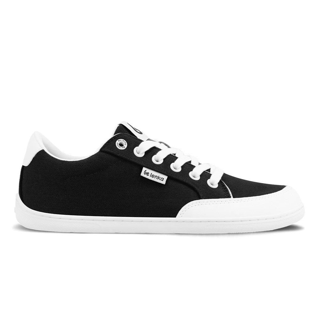 Black Be Lenka Rebound sneakers with white laces, microfiber toe guards, heel accents, and rubber soles. Right shoe is facing right against a white background. #color_black-white