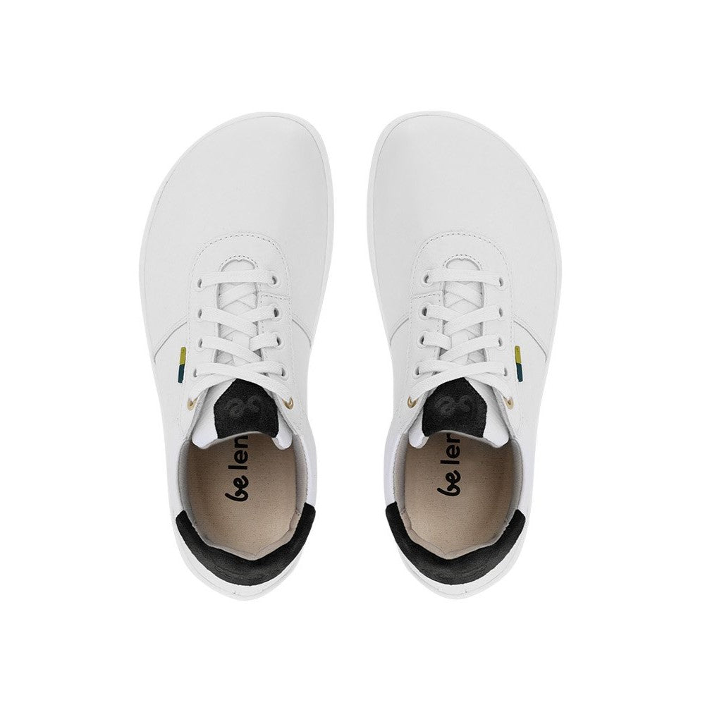 A photo of Be Lenka Royale sneakers made with a leather upper and a rubber sole. The sneakers are a white color and the area around the heel is black, they have small yellow and blue tag on the side. Both sneakers are shown facing upright beside each other from the top down against a white background. #color_white-black