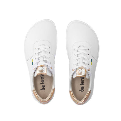 Photo 1 - A photo of white & gold Be Lenka Royale Sneakers. Shoe is simple in design with gold accents on the top of the tongue and heel. Right shoe is shown facing right against a white background. Photo 2 - both shoes are shown from above against a white background. #color_white-gold