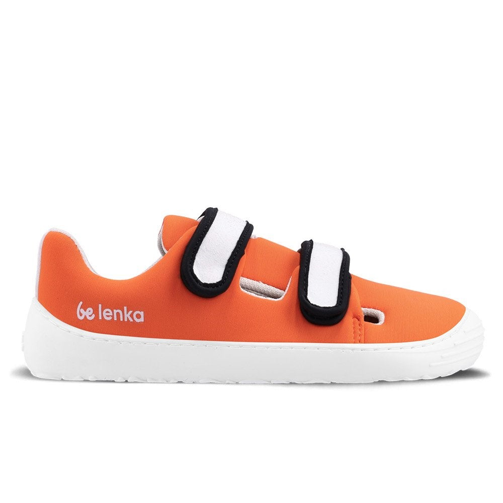 Photo 1 - A photo Be Lenka Kids Seasiders summer sandal sneakers in orange with white soles. Shoes are made of neoprene with two velcro straps. Straps are white with black edging, resembling a clown fish. The tongue does not quite touch the side of the shoe, leaving some breathable holes for summer time. Right shoe is shown from the right side against a white background. Photo 2 - Both shoes are shown from the top down against a white background. #color_orangy