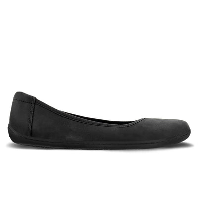A photo of the Be Lenka Sophie flats made from a leather upper and a microfiber interior. The flats are black in color with black rubber soles and are a simple ballerina flat design. The left shoe is shown from the right side on a white background. #color_matte-black