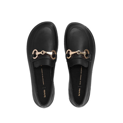 A photo of Black Be Lenka Viva leather loafers. A gold buckle detail graces the vamp. TR soles are stitched on for longevity. Both shoes are shown here from the top against a white background. #color_black