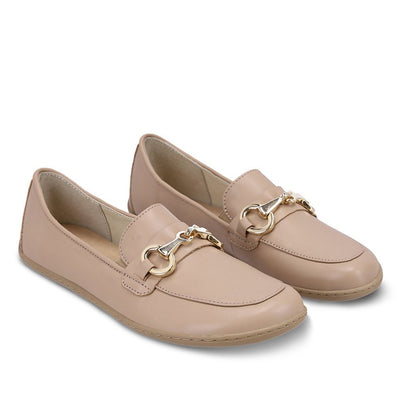 A photo of Latte Brown Be Lenka Viva leather loafers. A gold buckle detail graces the vamp. TR soles are stitched on for longevity. Both shoes are shown here diagonally facing slightly right against a white background. #color_latte-brown 