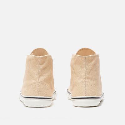 A photo of Bohempia Orik canvas high tops made from canvas and rubber soles. The sneakers are a tan color with a white toe cap and a black outline around the white rubber soles. Both sneakers are shown from the back against a white background. #color_tan-white