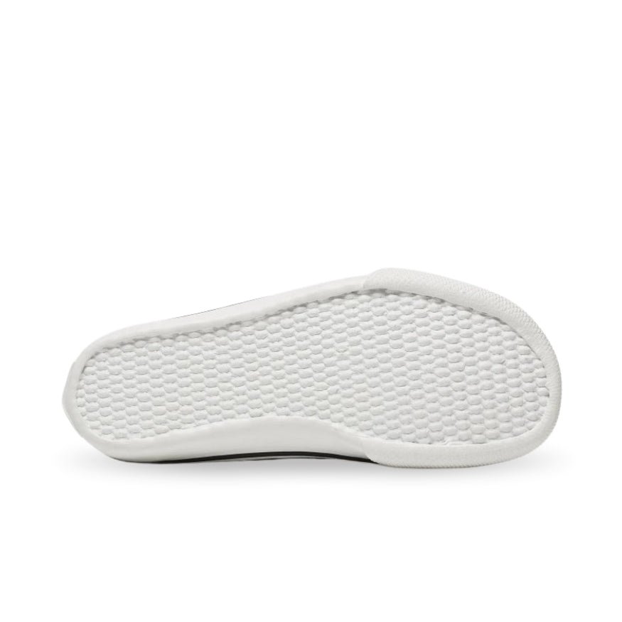 Tan Bohempia Orik canvas high tops. Sneakers have a white rubber toe cap with a black outline around the upper white rubber soles. Right shoe sole is shown facing right against a white background. #color_tan-white