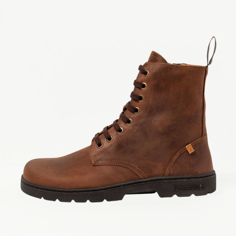 El Naturalista Nomada terra lace-up boot in profile, showing brown laces, side zipper, and black rubber sole. #color_terra