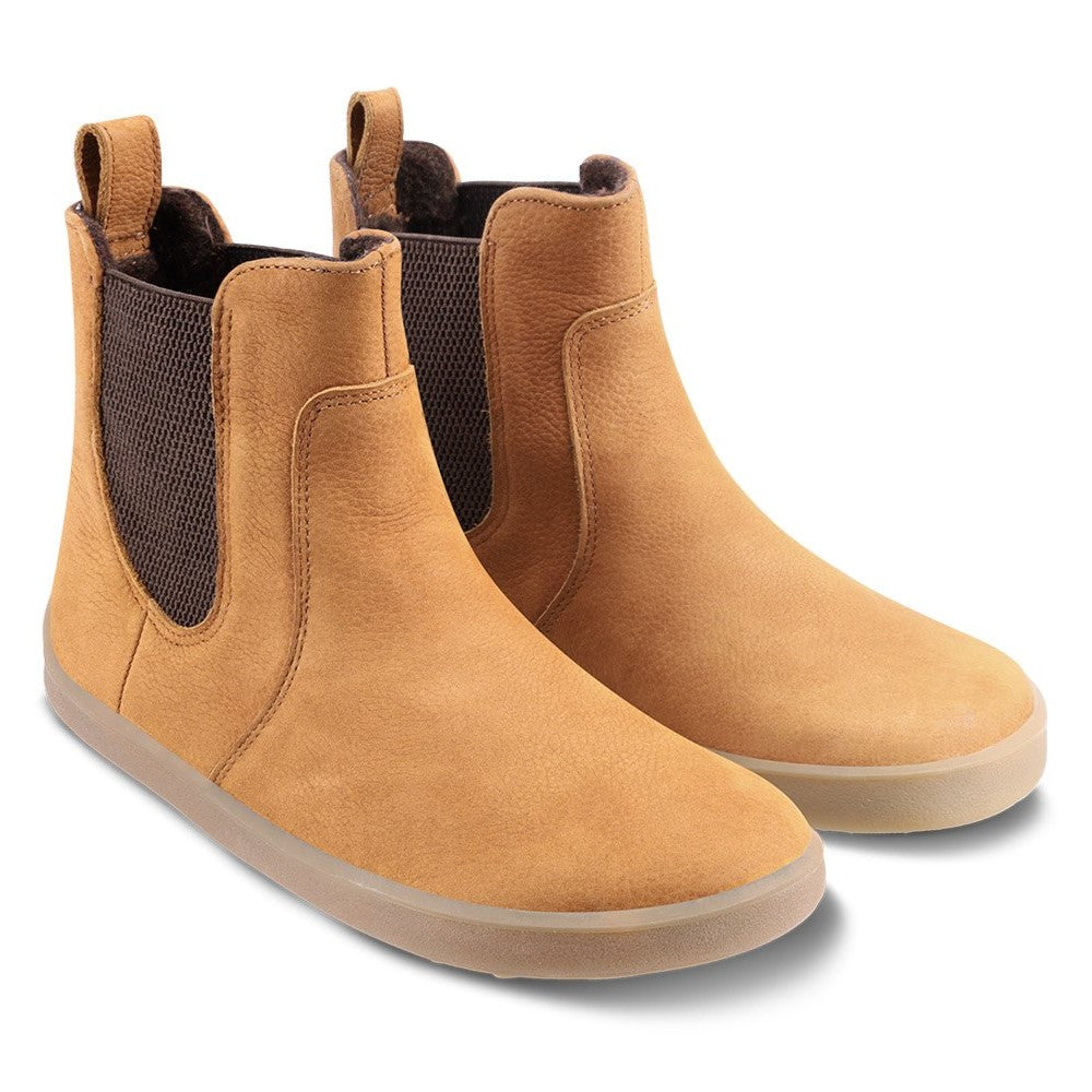 A photo of Be Lenka Entice boots made from nubuck leather and rubber soles. The boots are cinnamon in color, they are a Chelsea boot style with elastic at the sides. Both boot are shown beside each other angled slightly to the right against a white background. #color_cinnamon