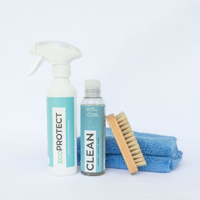 A photo of GoGo Nano Clean and Protect bottles with microfiber cloth and horse hair brush.