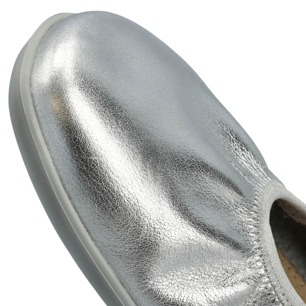 Silver Groundies Mary Jane with silver strap buckle and grey rubber soles. Right shoe toe box is shown close up against a white background. #color_silver
