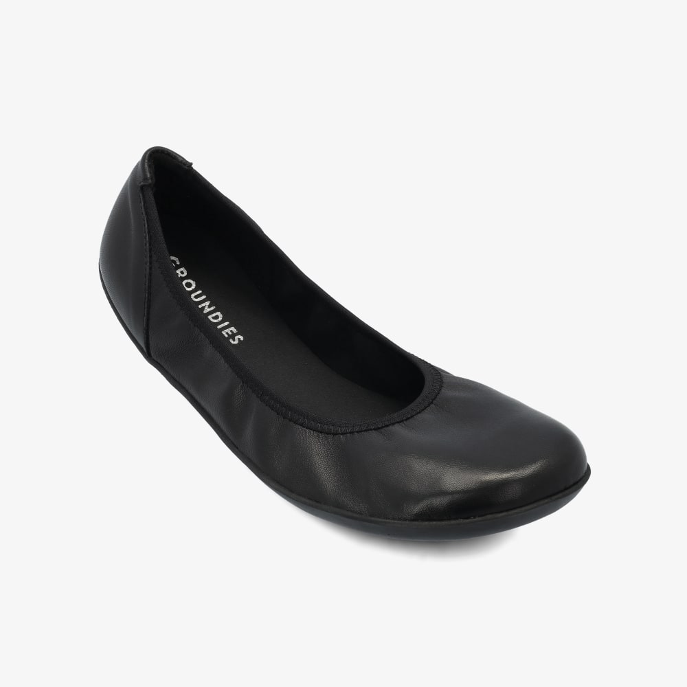 A photo of all black smooth leather Groundies Lily 2 Classic ballet flats. Right shoe is shown here facing diagonally right against a white background. #color_black