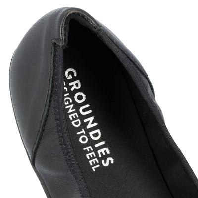 All black Groundies Lily 2 Classic ballet flats with an elastic opening. Right shoe heel is shown close up against a white background. #color_black