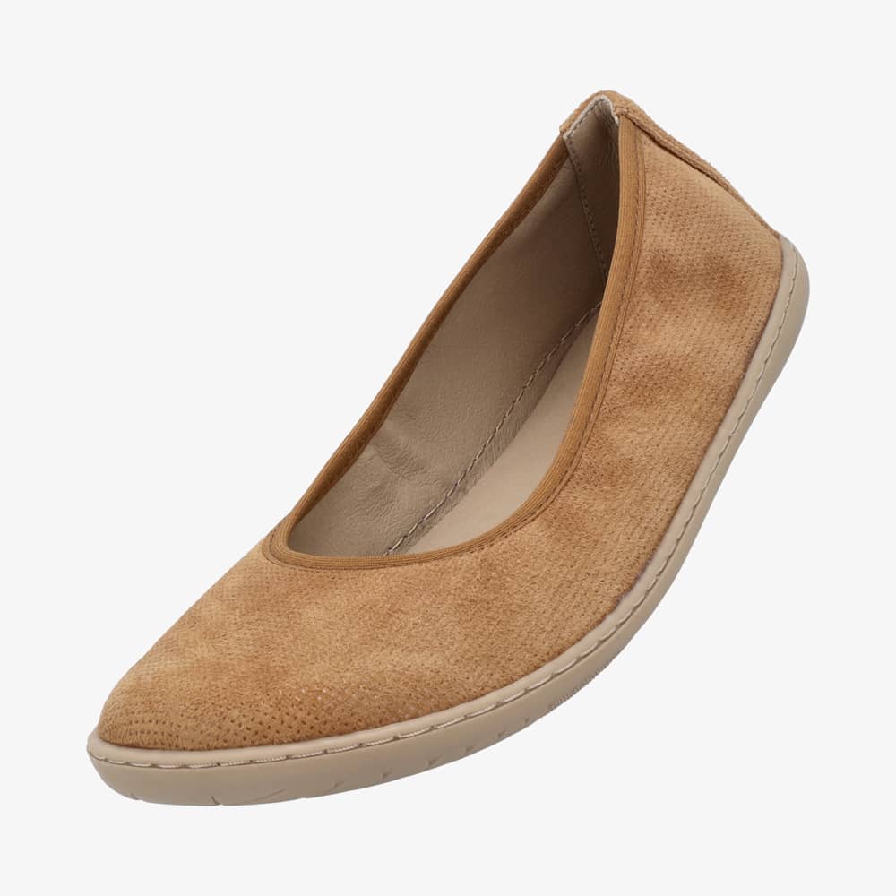 A photo of Groundies Lily Classic flats with a leather upper and tan rubber true sense soles. The flats are a perforated leather in a cognac color with trim around the tops. The interior of the flats is a light beige color. The left flat is shown from the left side floating pointing downward against a white background. #color_cognac