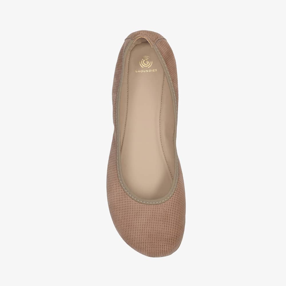 A photo of Groundies Lily Classic flats with a leather upper and tan rubber true sense soles. The flats are a perforated leather in a taupe color with trim around the tops. The right flat is shown floating facing downwards against a white background. #color_taupe