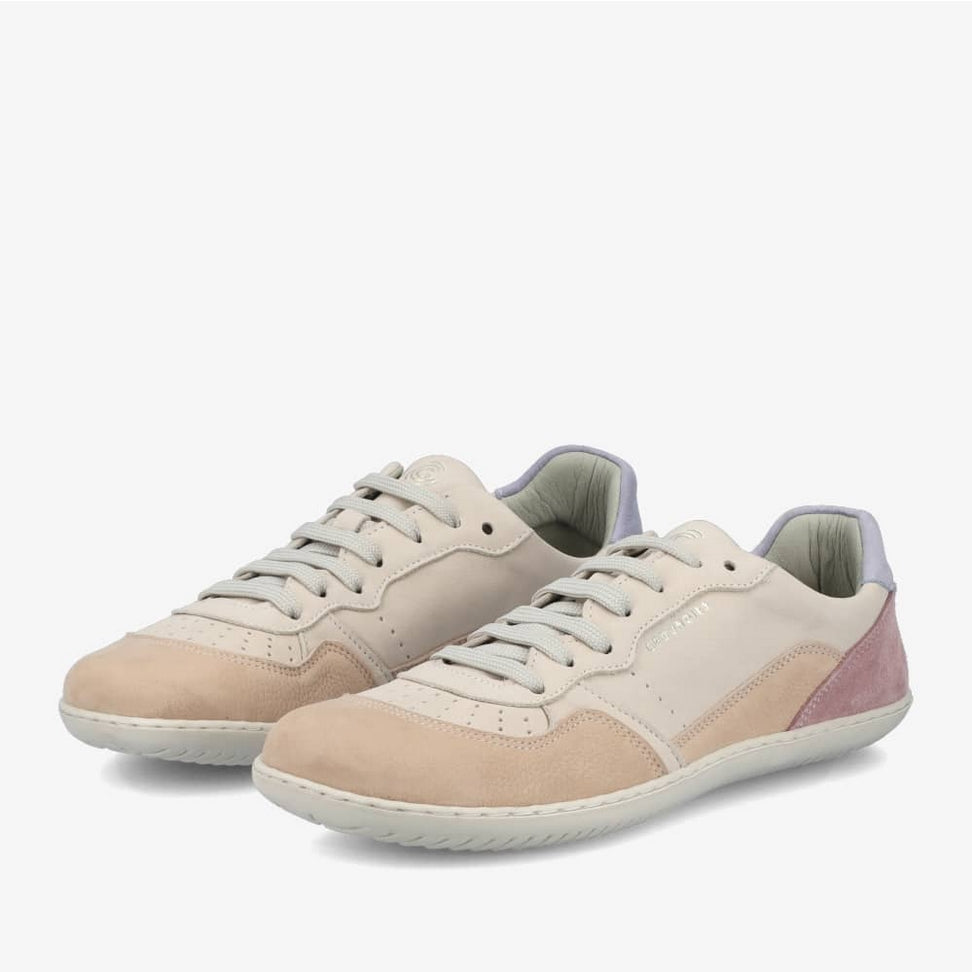 A photo of Groundies Nova GO1 Sneakers made with soft leather and white rubber soles. The sneakers have Beige, Periwinkle, and Pink color blocks. Both shoes are shown diagonally from the left against a white background in this photo. #color_beige-lavender-pink