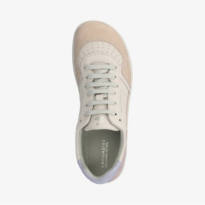 A photo of Groundies Nova GO1 Sneakers made with soft leather and white rubber soles. The sneakers have Beige, Periwinkle, and Pink color blocks. The right shoe is shown from the top down against a white background in this photo. #color_beige-lavender-pink