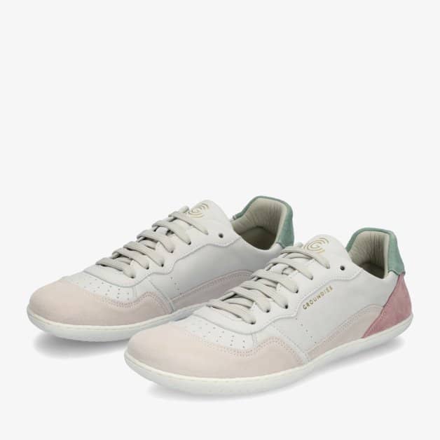 A photo of Groundies Nova GO1 Sneakers made with soft leather and white rubber soles. The sneakers have Beige, Green, and Pink color blocks. Both shoes are shown from the front left side against a white background. #color_beige-green-pink
