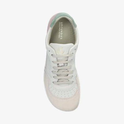 A photo of Groundies Nova GO1 Sneakers made with soft leather and white rubber soles. The sneakers have Beige, Green, and Pink color blocks. The right shoe is shown on the front above against a white background. #color_beige-green-pink